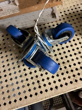 New set of 4 Blue Swivel Casters. Use on many projects.